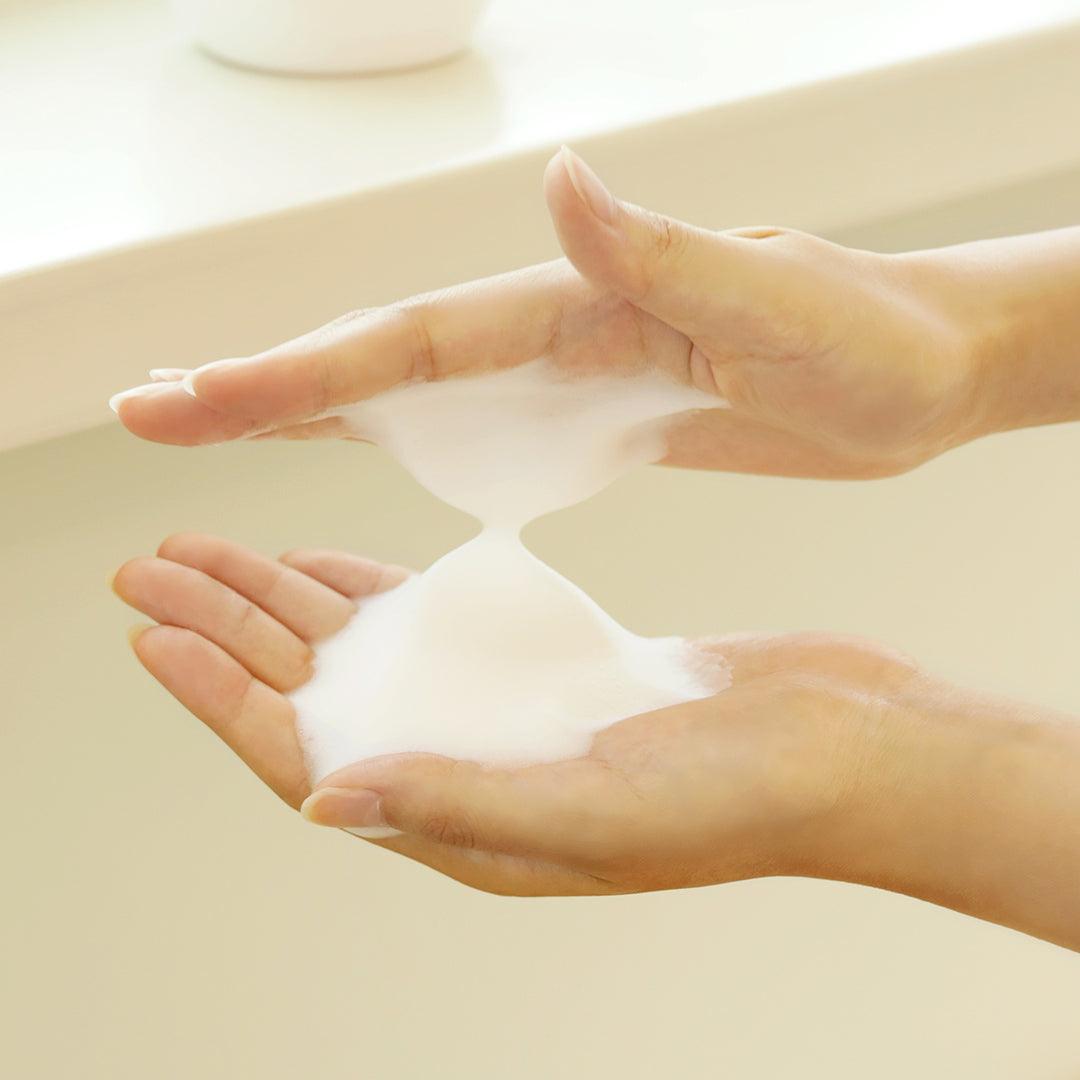 DIVE TO GREEN Korean Bubble Facial Cleanser. Product sample on hands.